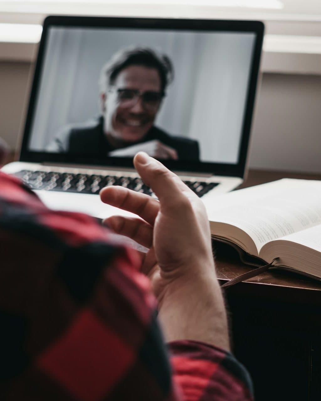 A person in a secure video therapy session at home, representing online therapy across Connecticut