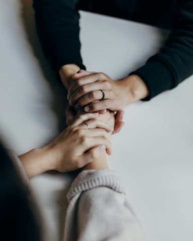 Supportive hands during a therapy intensive